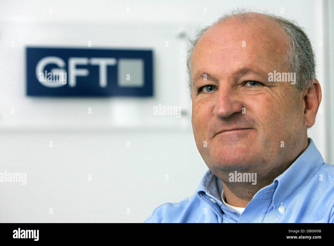 The CEO of  the service company GFT Ulrich Dietz is pictured in front of the company's logo in Sankt Georgen, Germany, 07 September 2007. The globally positioned company has a staff of 1,100. Photo: Patrick Seeger Stock Photo