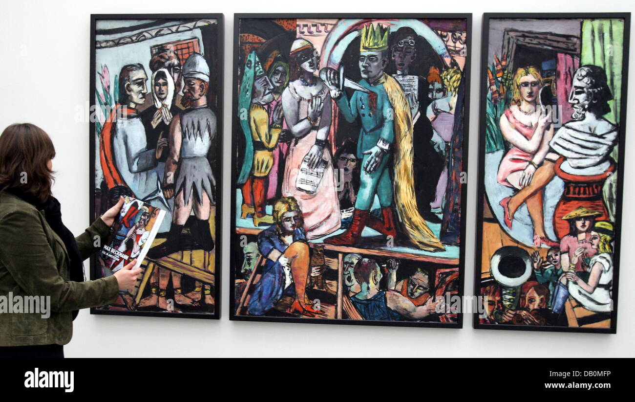 A visitor looks at the triptych 'Schauspieler' by Max Beckmann