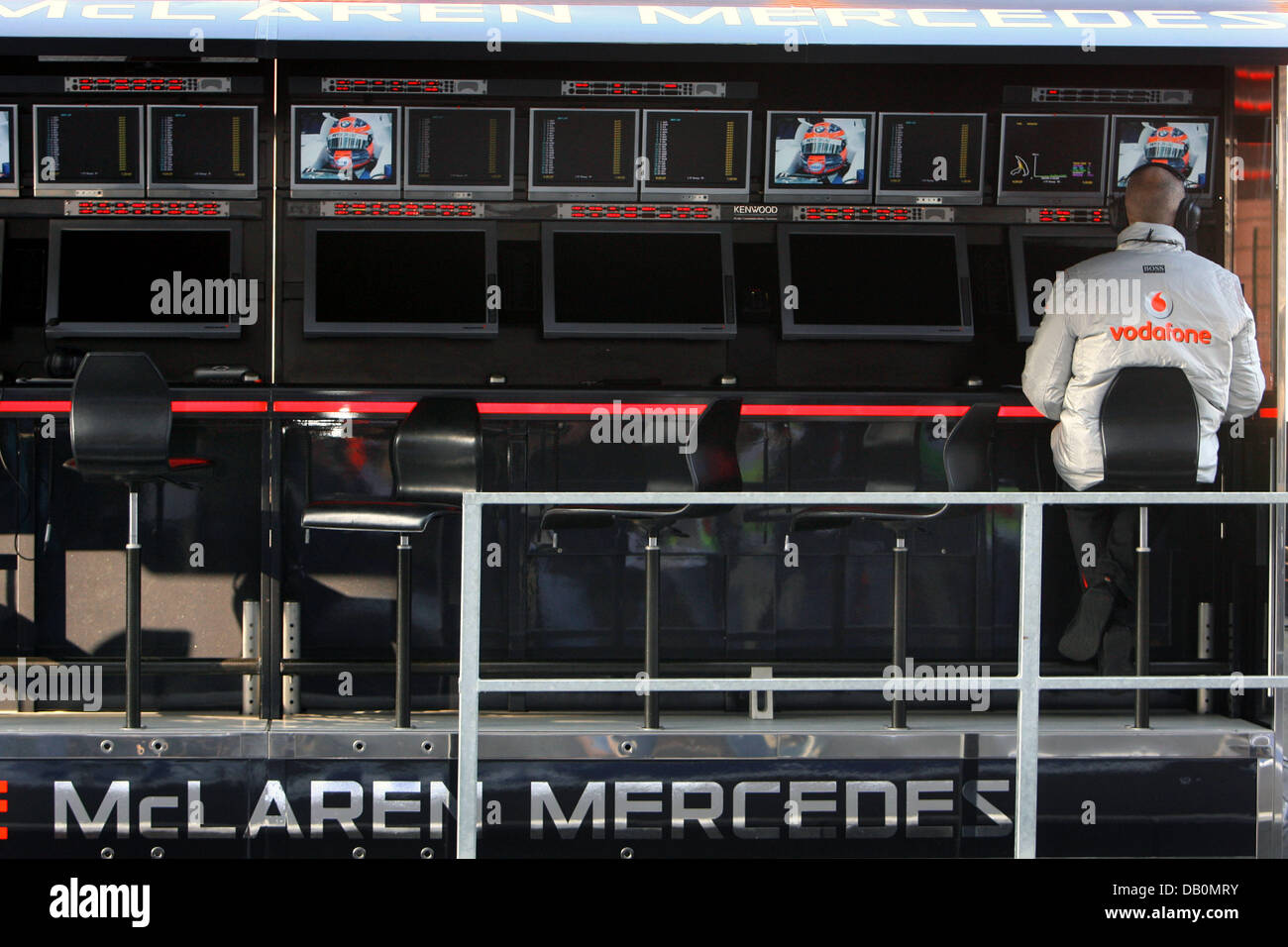 A McLaren Mercedes team member follows the first practice session from the control booth at the race circuit in Spa-Francorchamps, Belgium, 14 September 2007. The 2007 Formula 1 Belgian Grand Prix will be held on 16 September 2007. Photo: Jens Buettner Stock Photo