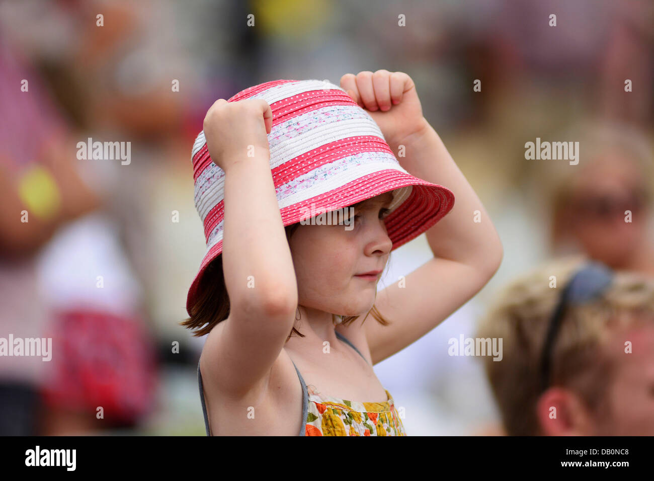 Alcester, Warwickshire. 21st July, 2013. A young spectator watching an event in the ring at at the CLA Game Fair, Ragley Hall, Alcester, Warwickshire, 19,20,21st July. Photo by John Robertson, 2013. Credit:  John Robertson/Alamy Live News Stock Photo