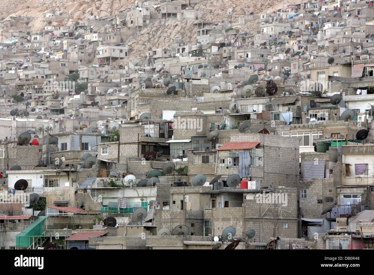 Houses built into a leaning in Damascus, Syria, 29 August 2007. Photo