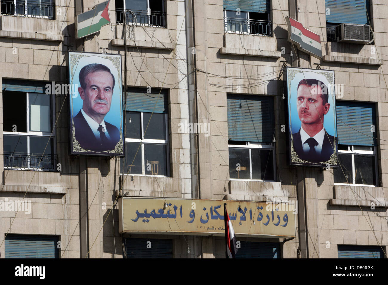 The pictures of Syrian president Baschar al-Assad and his deceased father Hafez al-Assad hang at the front of a house in Damaskus, Syria, 28 August 2007. Photo: Rainer Jensen Stock Photo