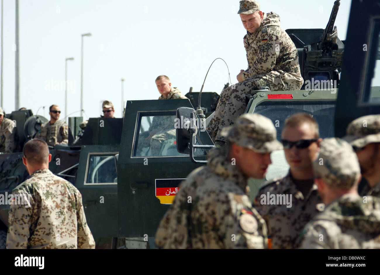 Bundeswehr soldiers wait on their vehicles at the Bundeswehr camp in ...