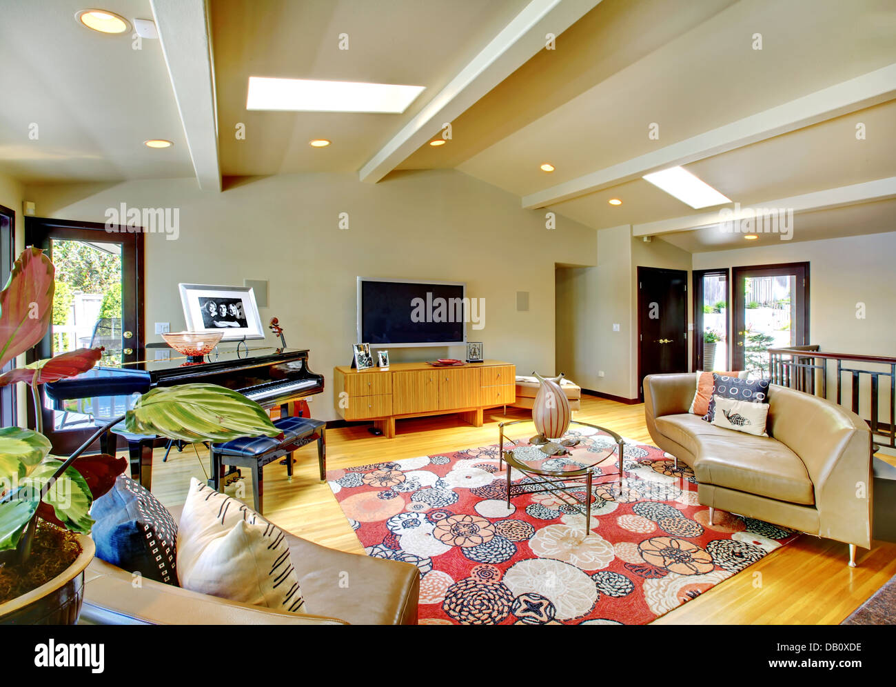 Open modern luxury home interior living room with piano Stock Photo - Alamy