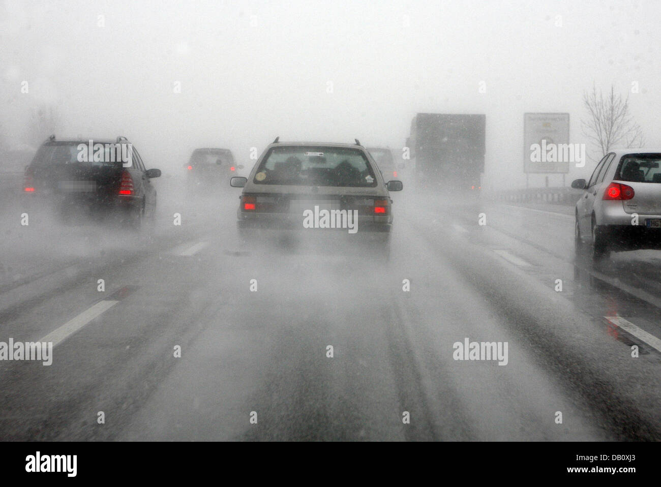 (dpa file) The file picture dated 21 February 2006 shows poor visibility conditions and carriageway slickness during sleet on autobahn A45 near Siegen, Germany. The solution for a safer driving is to maintain your distance and to reduce speed. Photo: Frank Rumpenhorst Stock Photo