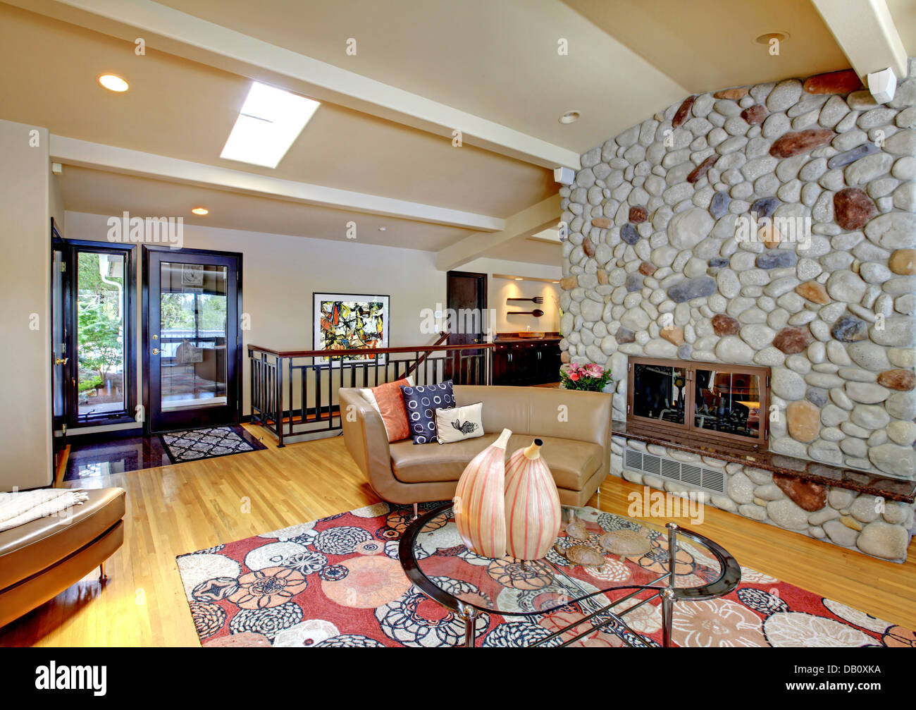 Open modern luxury home interior living room and stone fireplace Stock ...