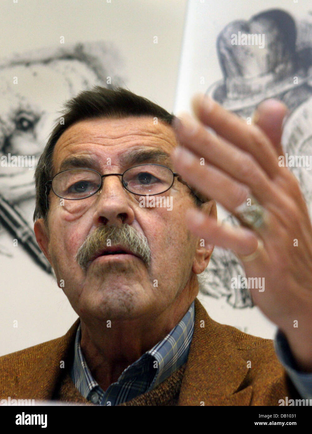Nobel Prize-winning German author Guenter Grass, sitting in front of his drawings, speaks during a press conference held in association with publishing house Steidl at Frankfurt Book Fair in Frankfurt Main, Germany, 12 October 2007. Grass, who will celebrate his 80th birthday on 16 October 2007, presented the complete edition of his works at the world's largest trade fair for books Stock Photo
