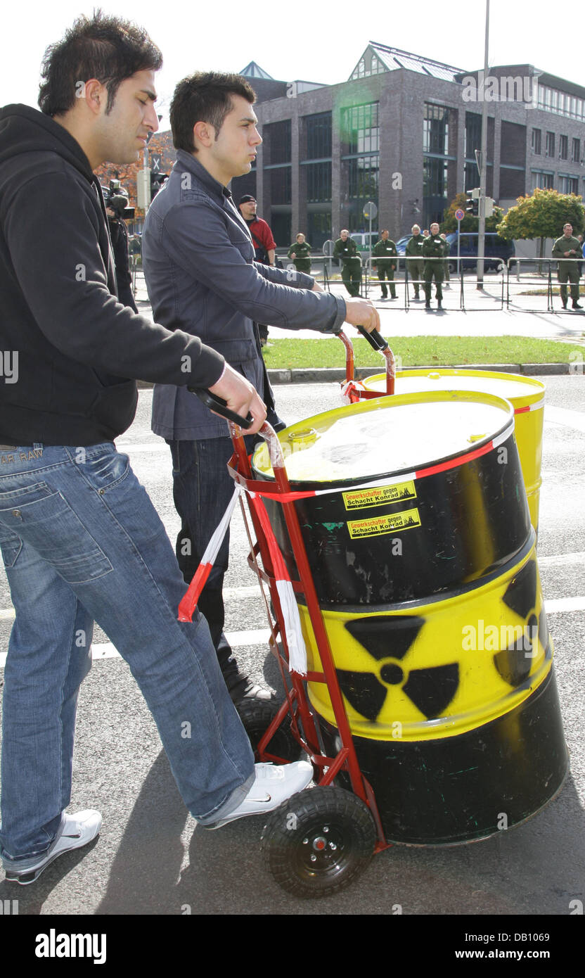 Nuclear energy opponents roll symbollic atomic waste bins during a protest march in Salzgitter, Germany, 13 October 2007. About 1.500 people demonstrated against Schacht Konrad, the permanent repository for nuclear waste intended to be errected at Salzgitter. The demonstrators also passed the Federal agency for Radiation protection (BfS). Photo: Peter Steffen Stock Photo