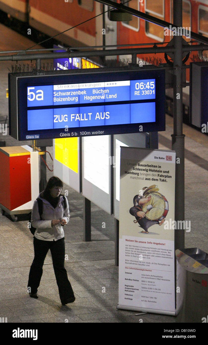 A display panel lists cancelled and delayed trains due to a strike of ...