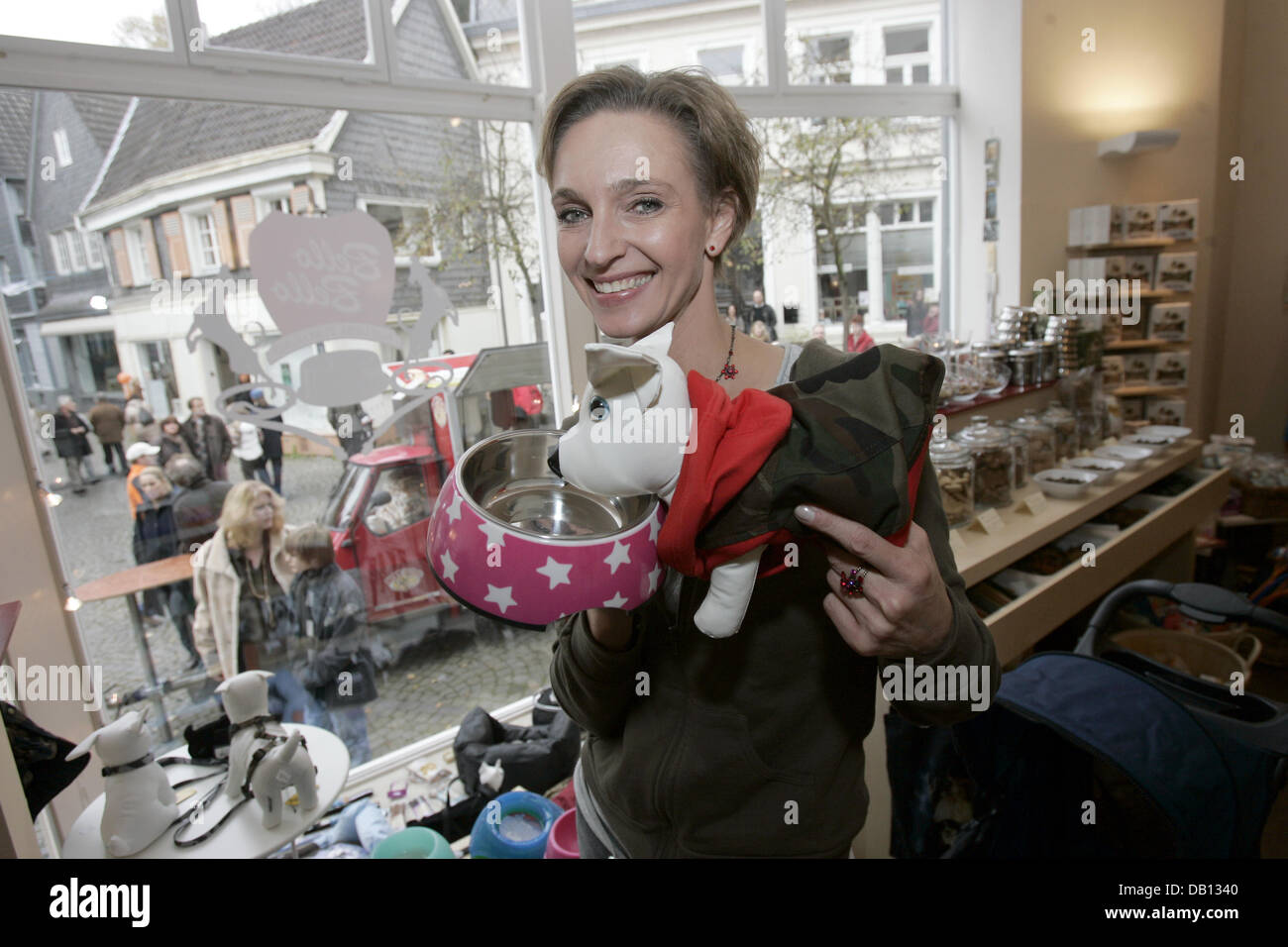 Actress Conny Niedrig poses with dog toys at the opening of her dog parlour in Essen, Germany, 28 October 2007. With the opening  of the shop a long entertained youth dream came true for Niedrig, who stars in the SAT1 serial ?Niedrig und Kuhnt?. Photo: Joerg Carstensen Stock Photo