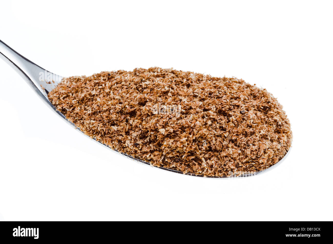 tablespoon of wheat bran close up isolated on white background Stock Photo