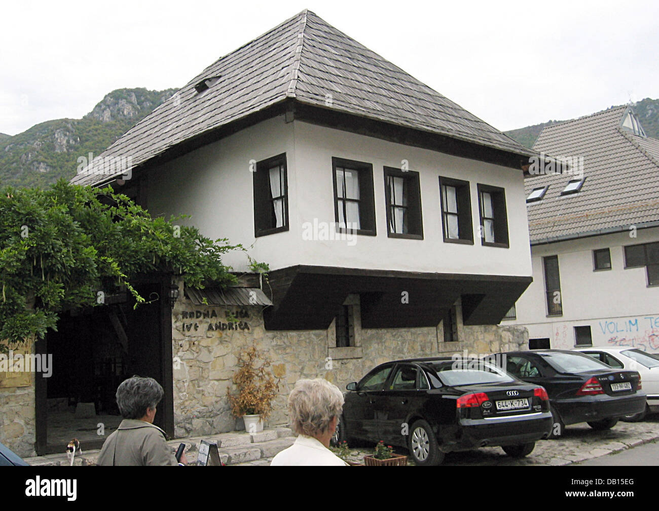 Two women pass the birth house of Ivo Andric, laureate of the Nobel Prize in Literature of 1961 in Travnik, Bosnia Hercegovina, 20 September 2007. Photo: Rolf Haid Stock Photo