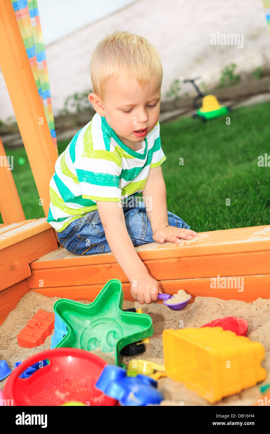 little boy playing in the backyard Stock Photo Alamy
