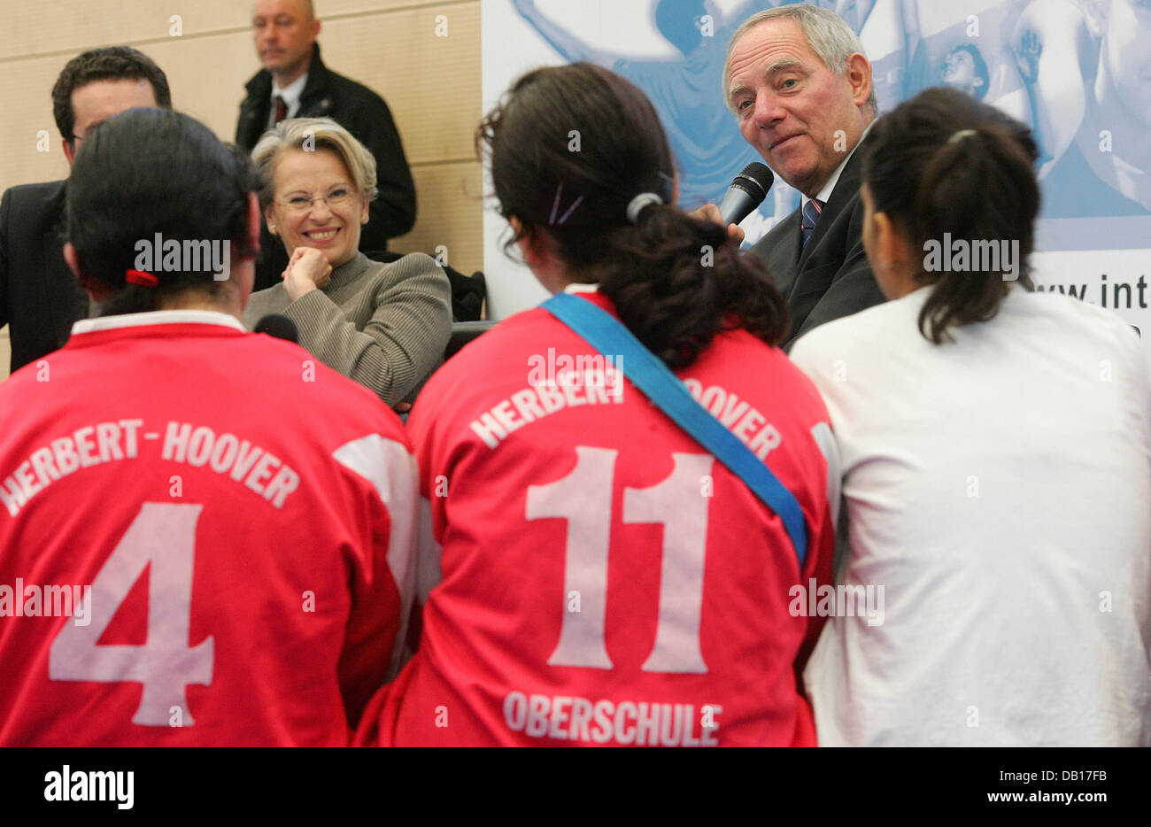 German Minister of the Interior, Wolfgang Schaeuble (R) and his French counterpart Michele Alliot-Marie talk with youths in Berlin, Germany, 12 November 2007. The two visited  'Weddinger Wiesel e.V.' basketball club and the women's soccer club of 'Herbert-Hoover-Oberschule'. The French President and members of the French government arrived in Berlin this Monday for the traditional  Stock Photo