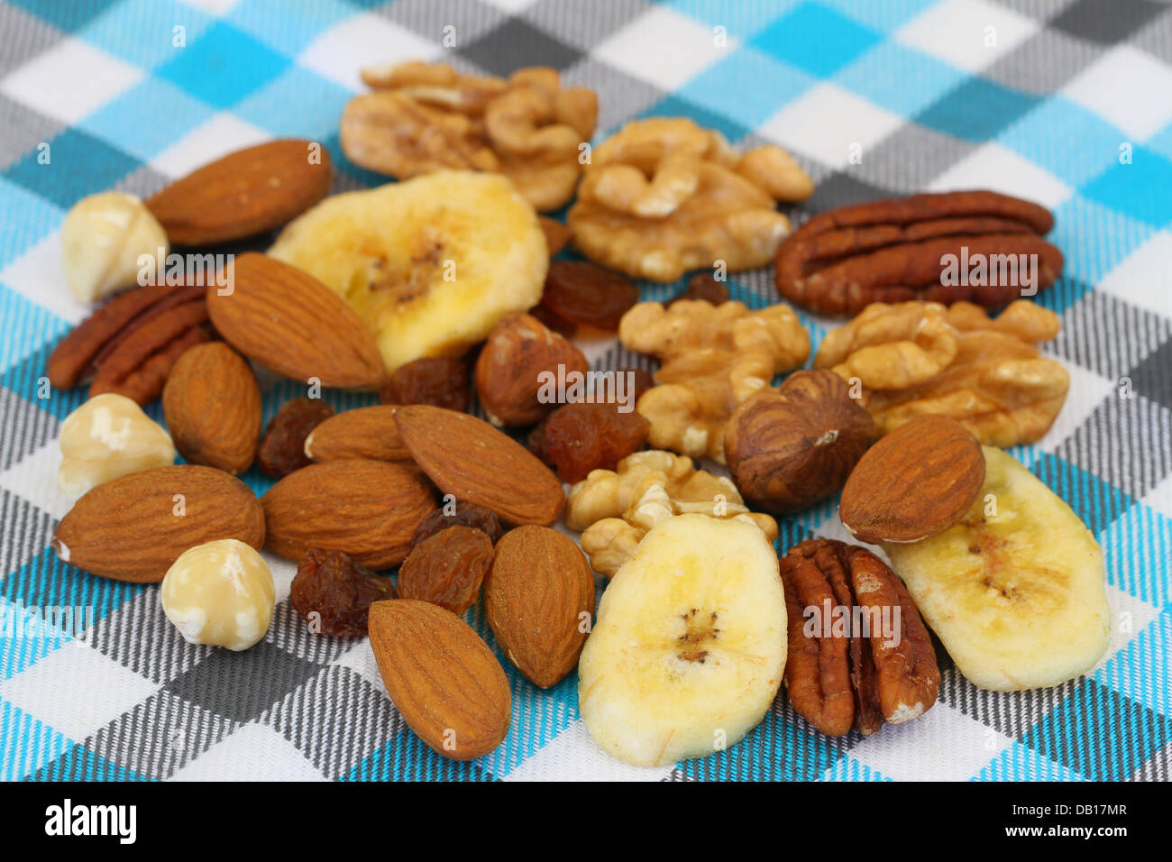 Mix nuts, almonds and banana chips on checkered surface Stock Photo Alamy