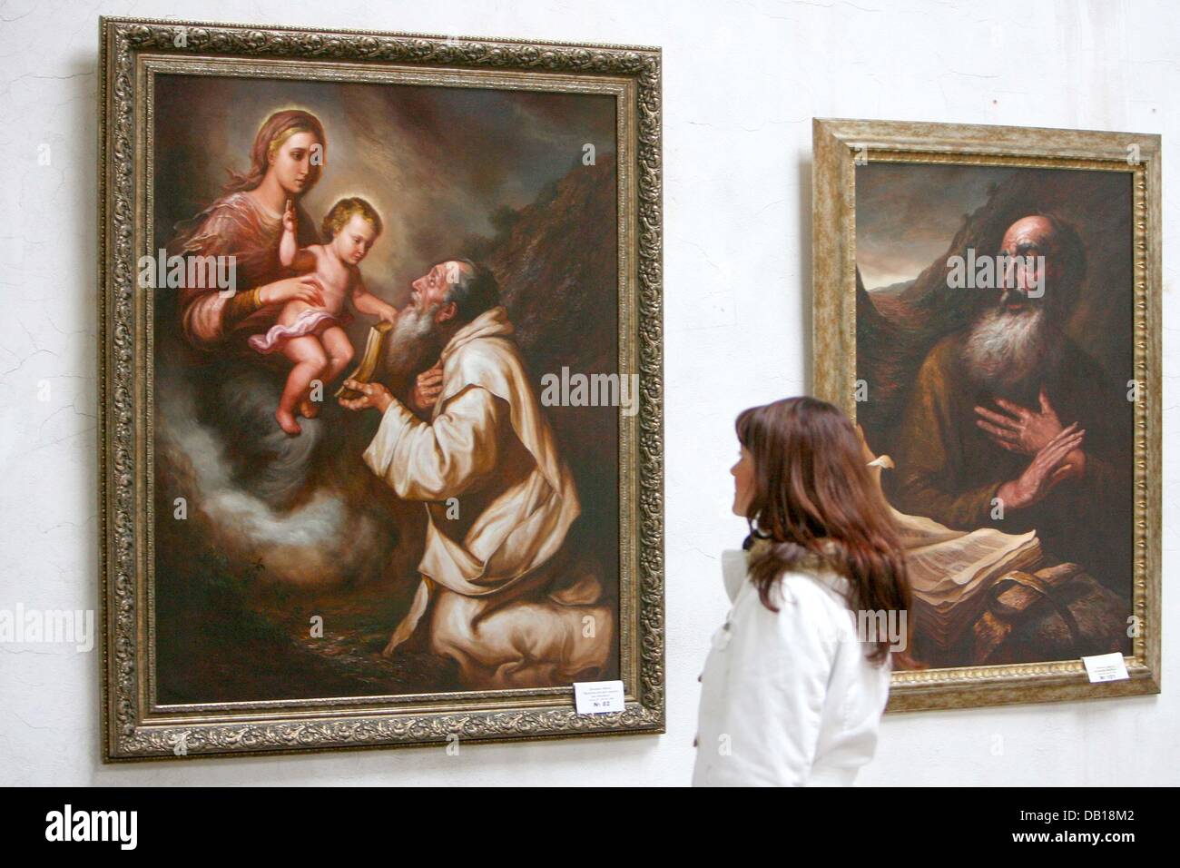 A young woman looks at the painting 'Madonna mit dem segnenden Kleinkind' ('Madonna with the Blessing Child') by Valeriy Shvetsov on display at the Ukrainian Culture Centre ('Kulturzentrum der Ukraine') in Magdeburg, Germany, 15 November 2007. The artwork belongs to the alltogether 400 paintings exhibited by 65 Ukrainian artists in the scope of the 6th Magedeburg Art Festival. This Stock Photo