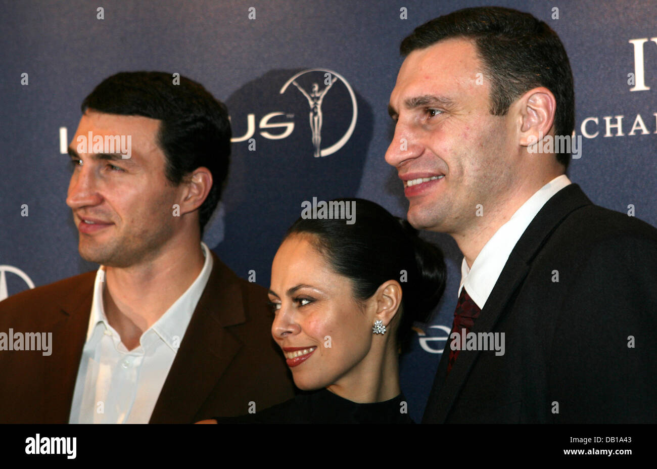 Boxers Vladimir Klitschko (L), Vitali Klitschko and his wife Natalia