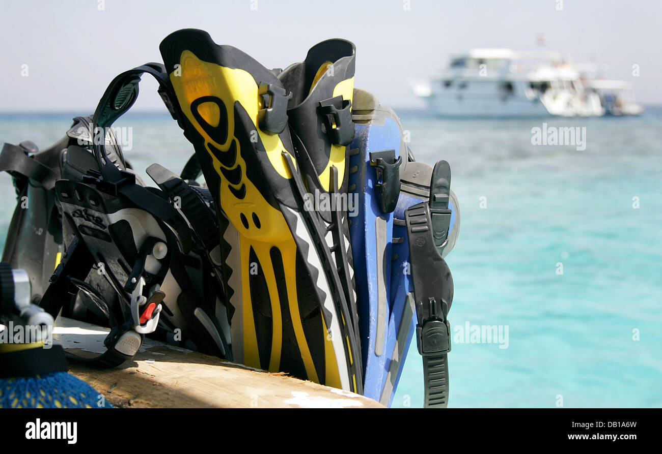 Diving fins are pictured on a boat offshore Hurghada, Egypt, 02 October 2007. The Red Sea is very popular for diving sports. Photo: Felix Heyder Stock Photo