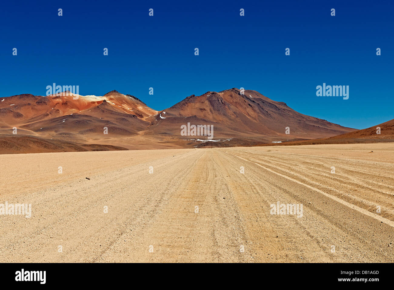 dirt road in landscape of Reserva Nacional de Fauna Andina Eduardo Abaroa, Bolivia, South America Stock Photo