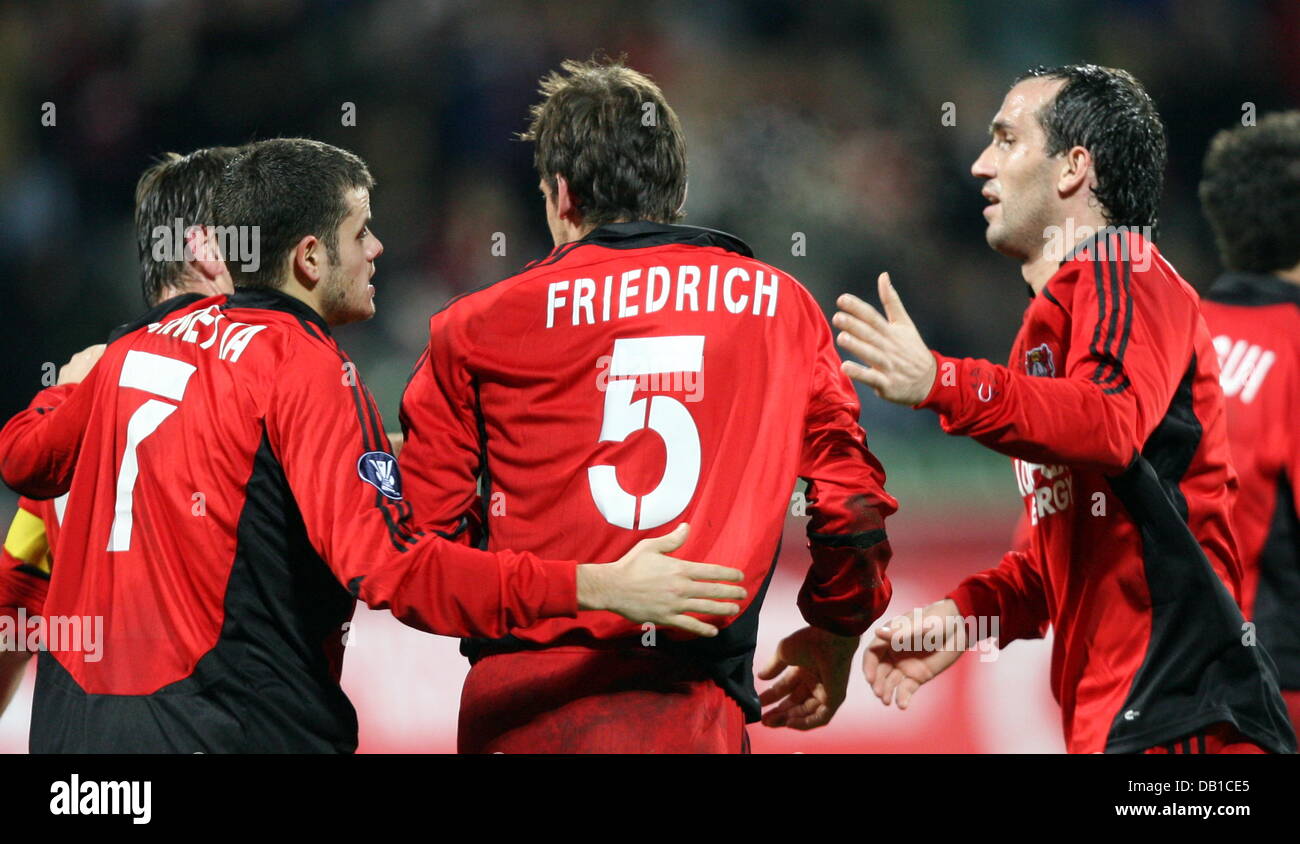 Leverkusen'S Tranquilo Barnetta (L) and Theofanis Gekas (R) cheer 1-0 scorer Manuel Friedrich (C) during the UEFA Cup group E match Bayer Leverkusen v Sparta Praha at BayArena in Leverkusen, Germany, 06 December 2007. Leverkusen defeated Sparta 1-0. Photo: Franz-Peter Tschauner Stock Photo