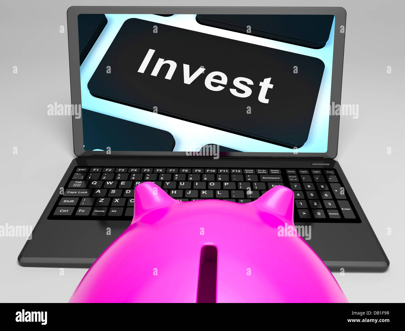 Invest Key On Laptop Showing Investment Market Stock Photo