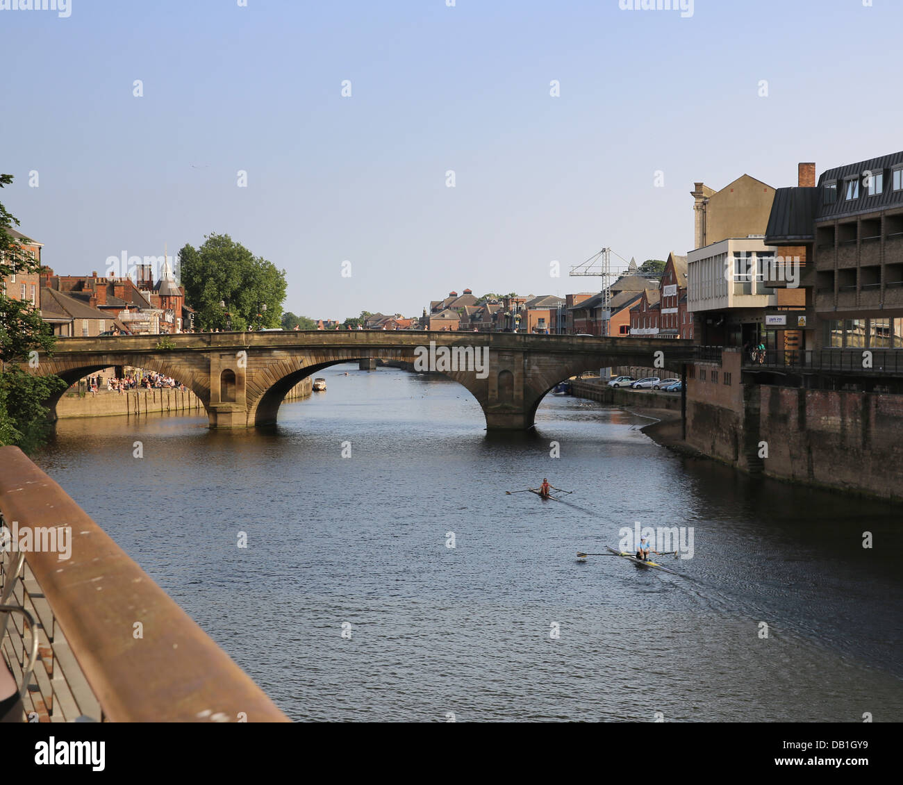 Boats are sculled along the River Ouse as sunset approaches in the ...