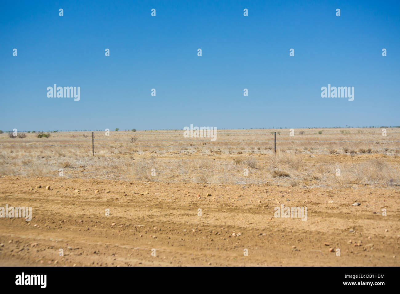 Dry, barren ground in drought conditions in outback Queensland, Australia Stock Photo