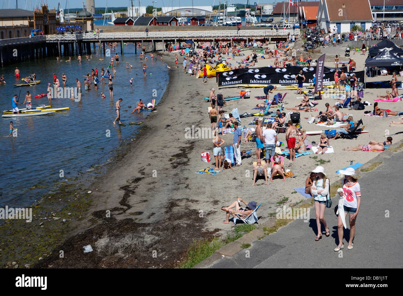 People bathing and sunning on the sandy beach. Varberg, Haland, Sweden. Stock Photo