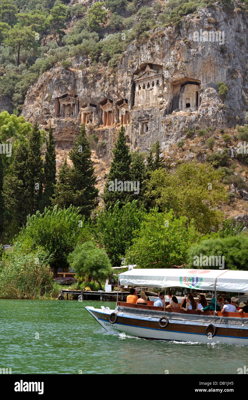 Rock tombs and tourist boats at the Dalyan river, Dalyan, Ortaca, Mugla, Turkey. Stock Photo