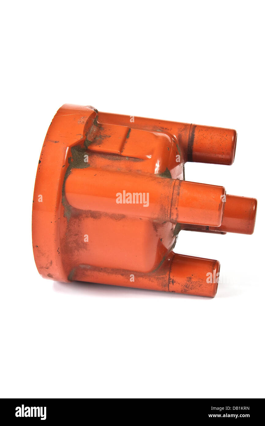 Long exploited and polluted distributor cap on a white background Stock