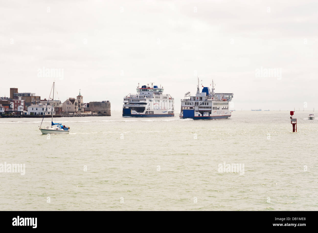 Two Isle of Wight ferries pass in Portsmouth Harbour, UK. Stock Photo