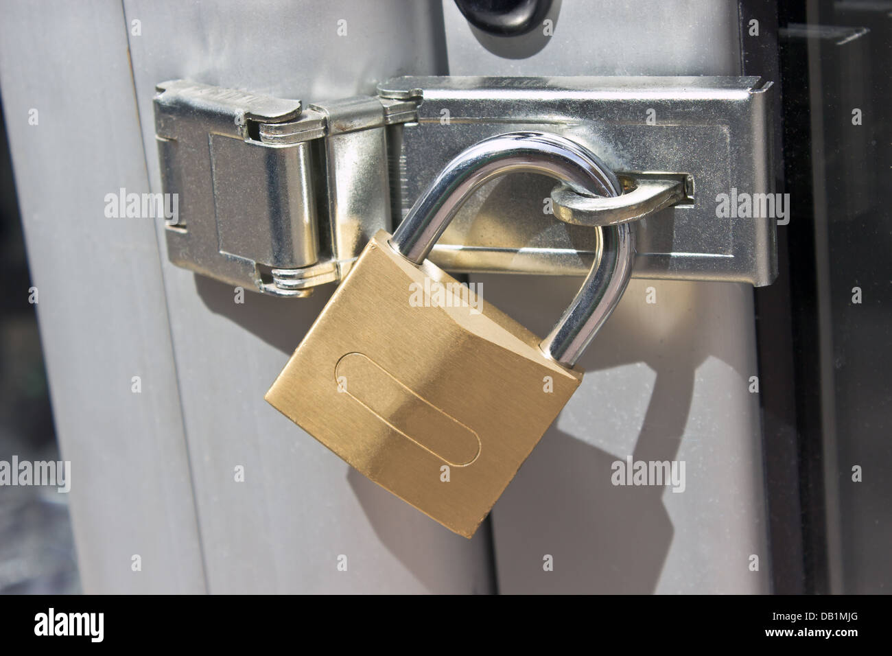 Closed padlock on a metal door Stock Photo Alamy