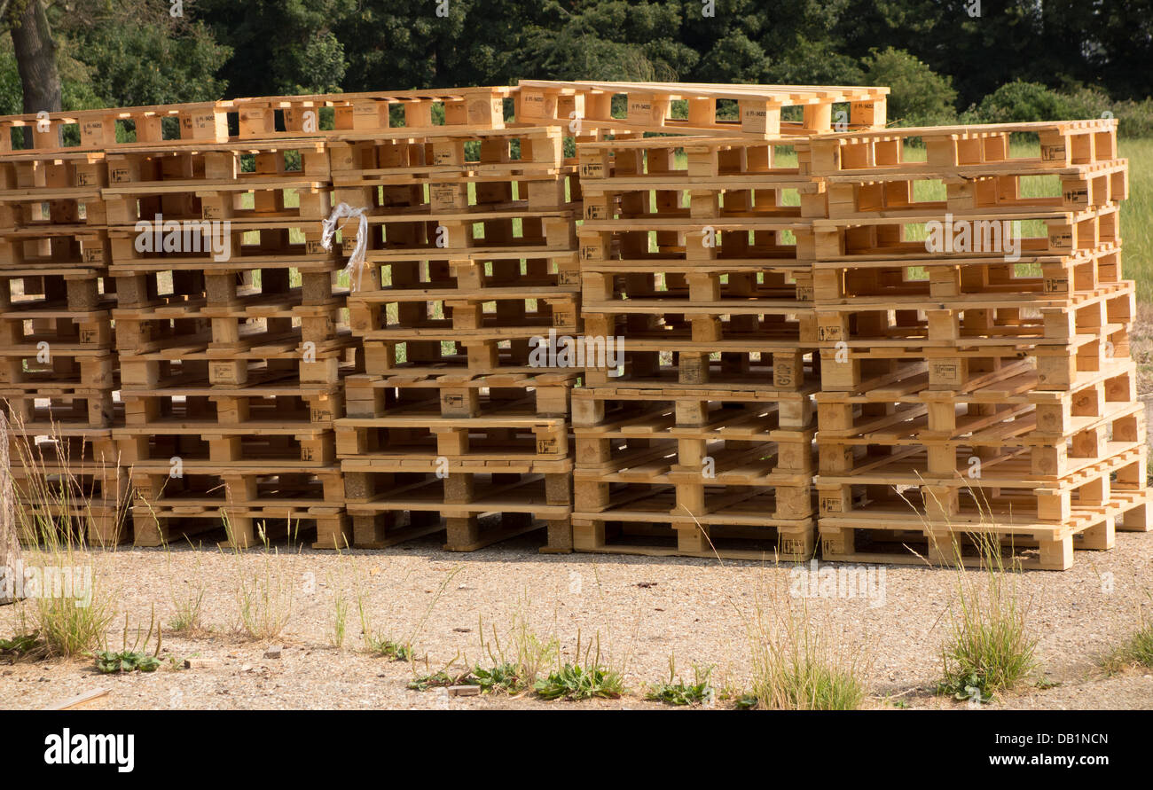 Stack of pallets on hard standing Stock Photo