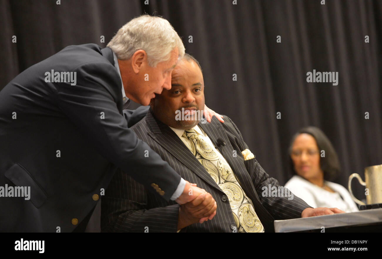 Secretary of Defense Chuck Hagel speaks with journalist and author Roland Martin during the Conference of Minority Transportation Officials July 16, 2013, in Jacksonville, Fla. Hagel was en route to Naval Air Station Jacksonville as part of a three-day tr Stock Photo