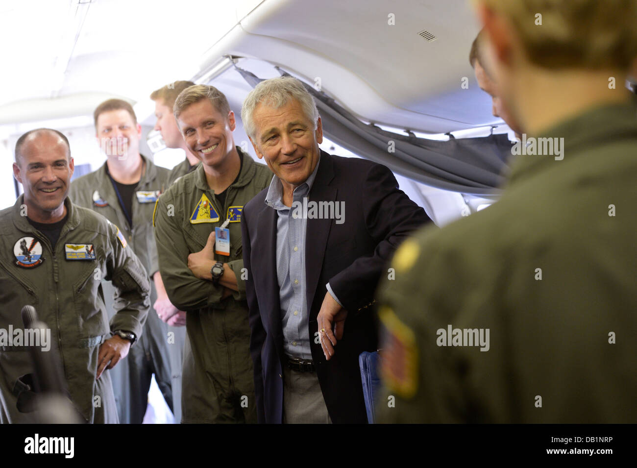 Secretary of Defense Chuck Hagel, center, tours the interior of a U.S. Navy P-8 Poseidon aircraft assigned to Patrol Squadron (VP) 30 July 16, 2013, at Naval Air Station Jacksonville, Fla. Hagel was on a three-day trip to visit several installations on th Stock Photo