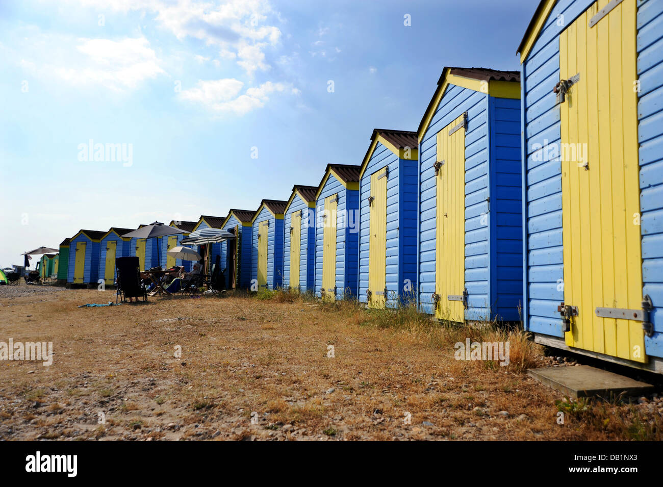 Littlehampton UK 18 July 2013 Blue and yellow beach huts at