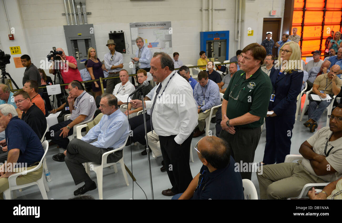 Civilian employees line up to ask questions during a Q-and-A session with Secretary of Defense Chuck Hagel, not shown, at Fleet Stock Photo