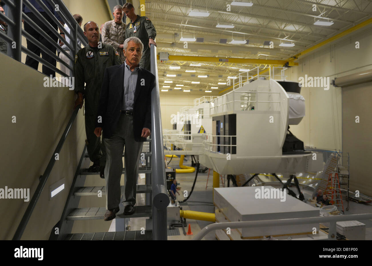 Secretary of Defense Chuck Hagel tours a room filled with U.S. Navy P-8 Poseidon aircraft flight simulators while visiting the Patrol Squadron (VP) 30 training facility July 16, 2013, at Naval Air Station Jacksonville, Fla. Hagel was on a three-day trip t Stock Photo