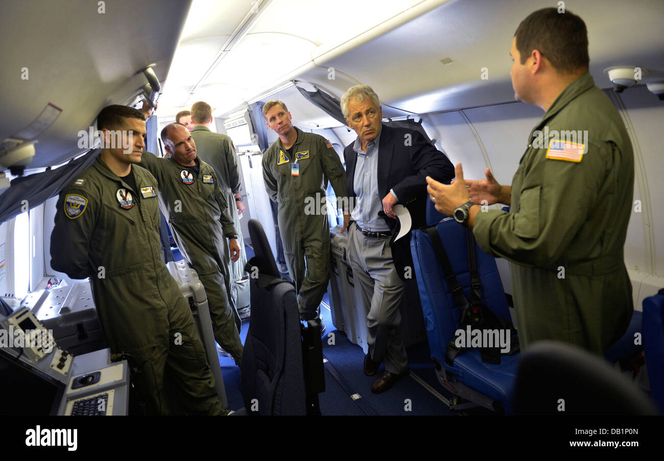 Secretary of Defense Chuck Hagel, second from right, tours the interior of a U.S. Navy P-8 Poseidon aircraft assigned to Patrol Stock Photo