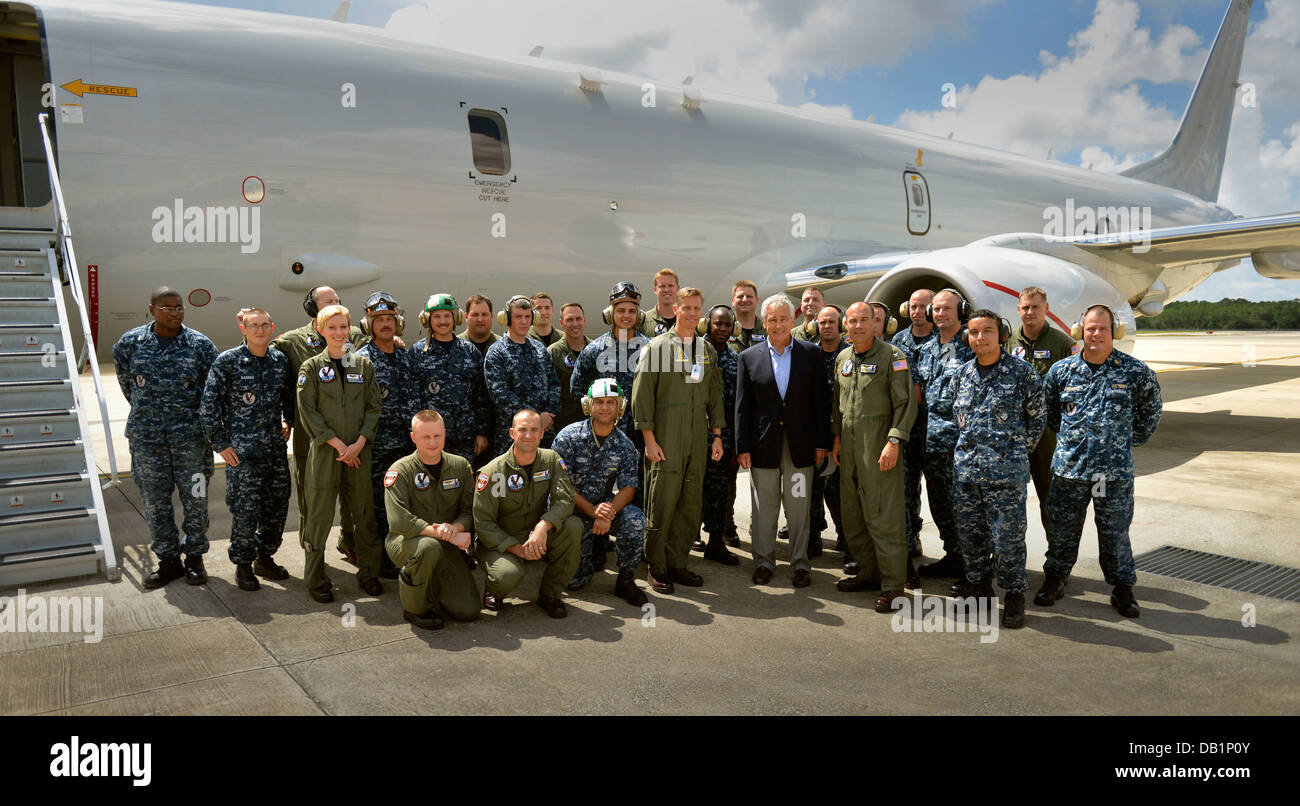 Secretary of Defense Chuck Hagel, front row, fourth from right, poses with U.S. Sailors assigned to Patrol Squadron (VP) 30 beside a P-8 Poseidon aircraft July 16, 2013, at Naval Air Station Jacksonville, Fla. Hagel was on a three-day trip to visit severa Stock Photo