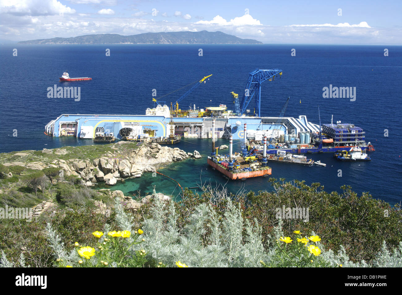 Costa Concordia lying on its side next to Giglio Island, Tuscan Archipelago, Italy - PREPARATIONS FOR ITS REMOVAL Stock Photo