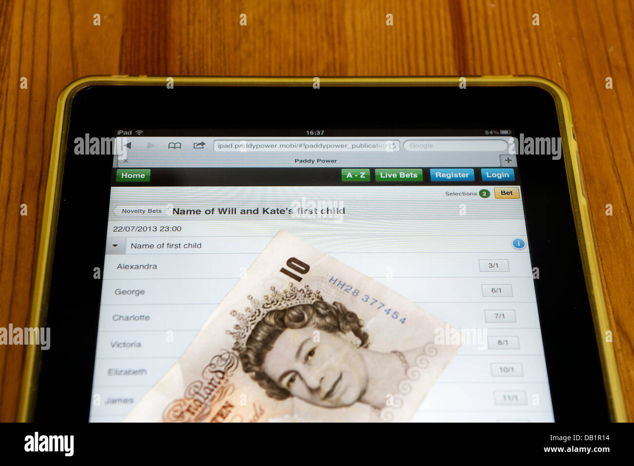 The betting prices listed on the paddypower online betting website for various possible names for the new royal baby are shown being viewed on an i pad. Stock Photo