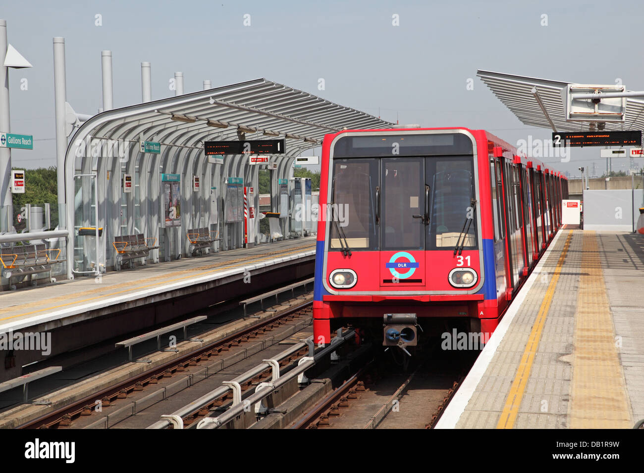 A London Docklands Light Railway train arrives at Gallions Reach station in Beckton, east London, UK Stock Photo