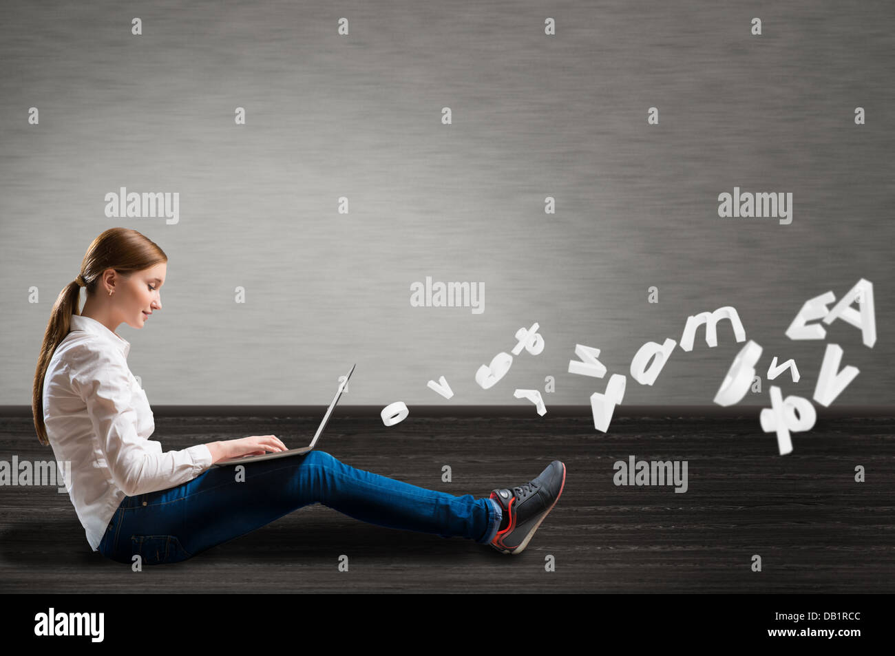 young girl sitting on the floor with a laptop Stock Photo - Alamy