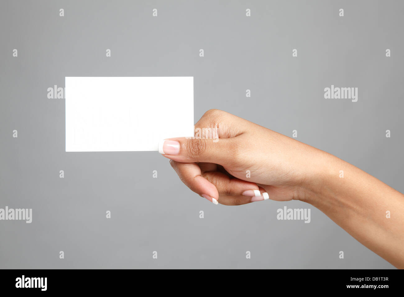 Women's hand holding a business card Stock Photo - Alamy