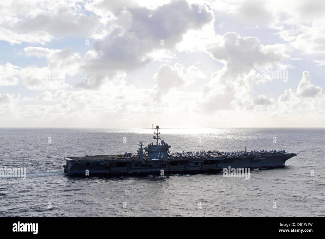The U.S. Navy's forward-deployed aircraft carrier USS George Washington (CVN 73) steams toward its area of operations to participate in exercise Talisman Saber (TS) 2013. The TS exercise series is a biennial training event aimed at improving Australian De Stock Photo