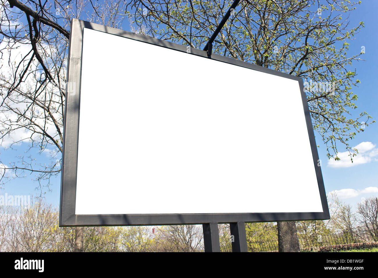 Blank billboard in a park with blue sky Stock Photo - Alamy