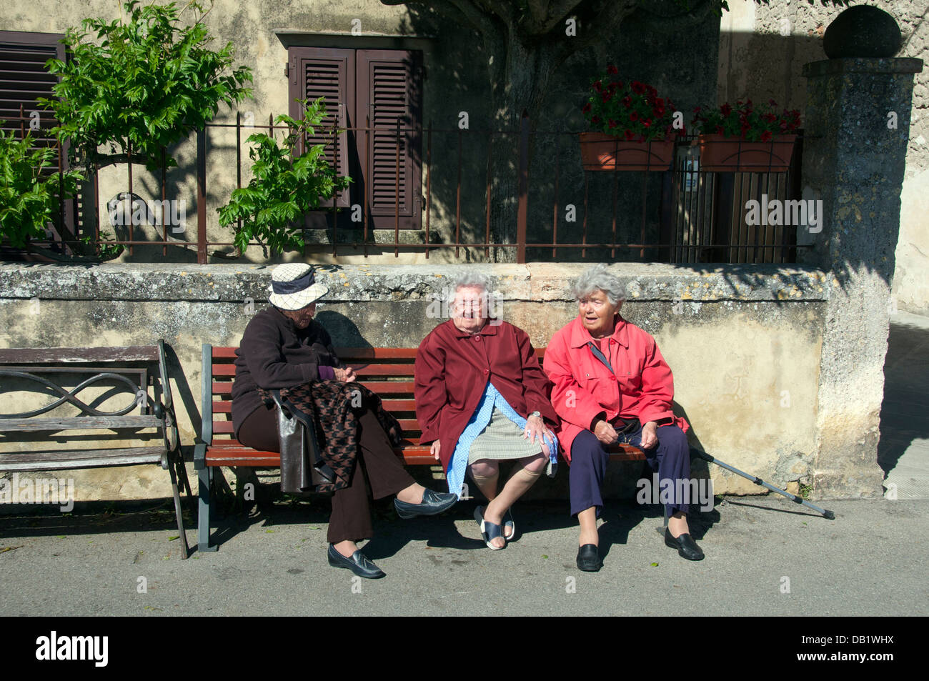 Three seated old ladies Volterra Tuscany Italy Stock Photo