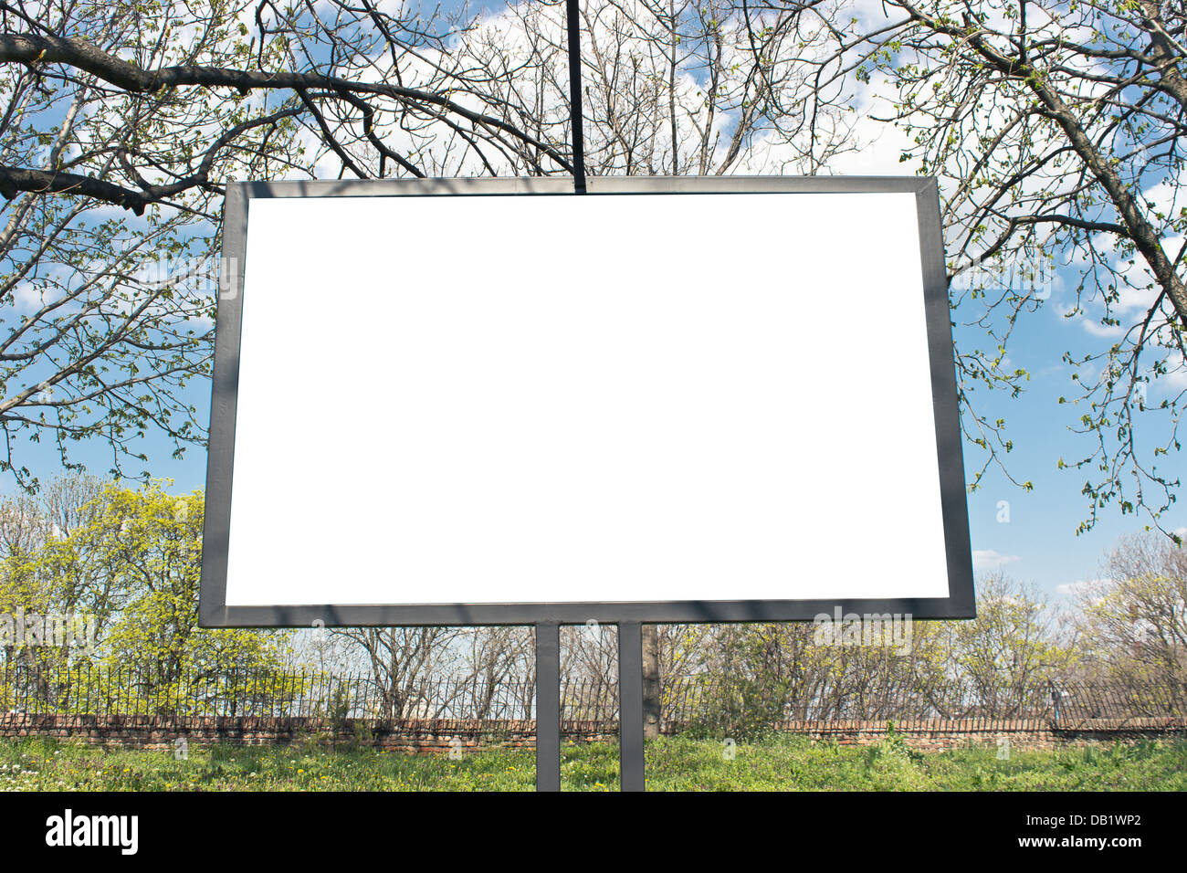 Blank billboard in a park with blue sky Stock Photo - Alamy