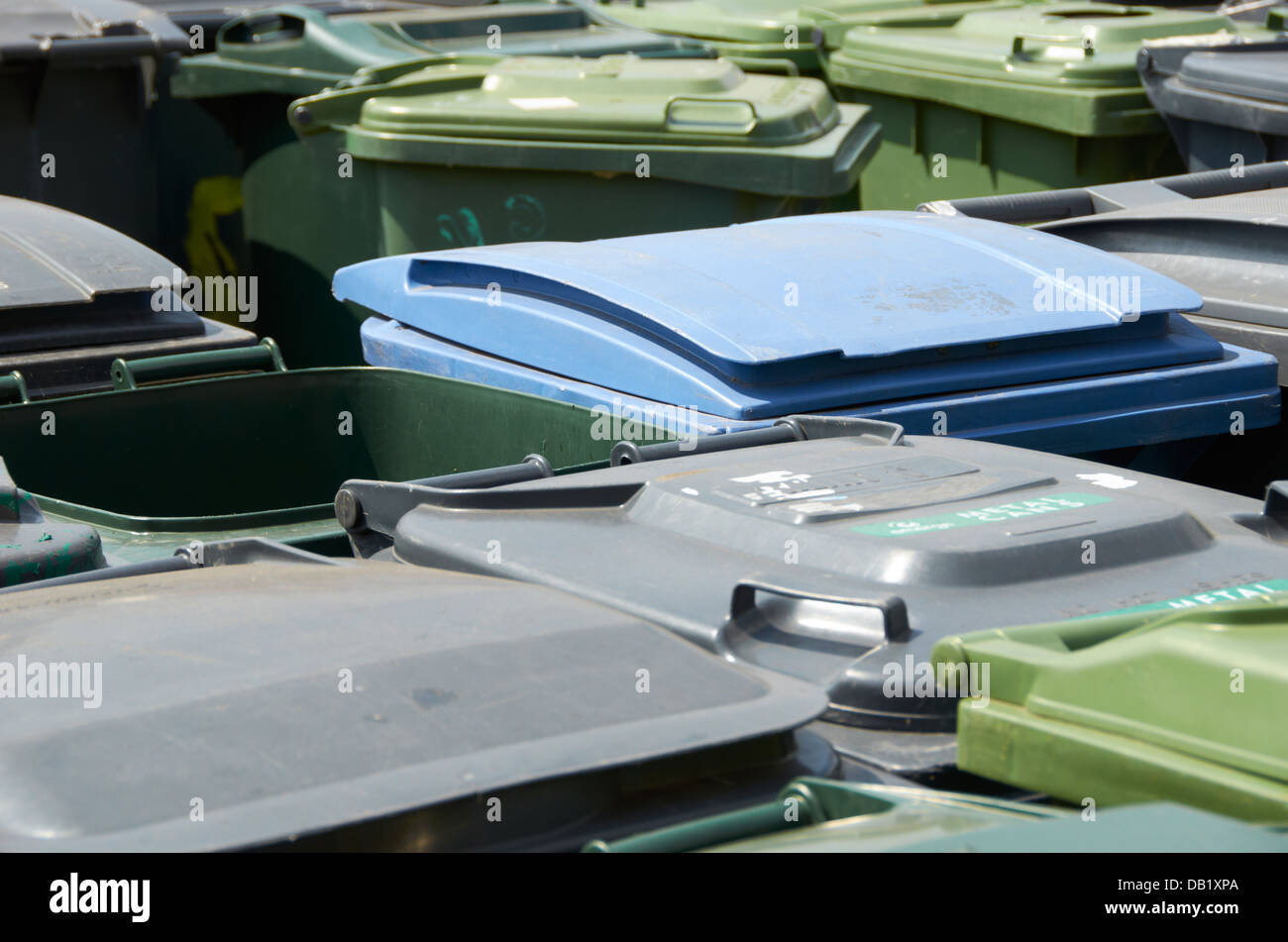 Rows of plastic rubbish bins at a recycling company in the UK Stock ...